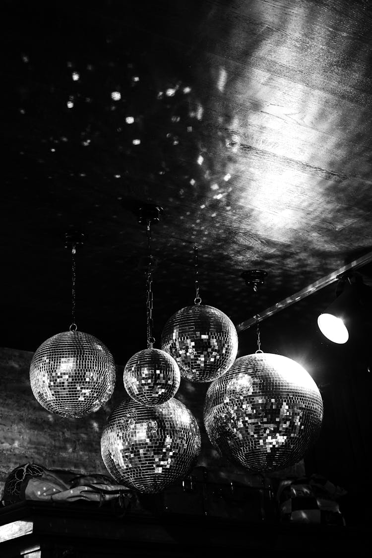 Disco Balls Hanging From Club Ceiling 