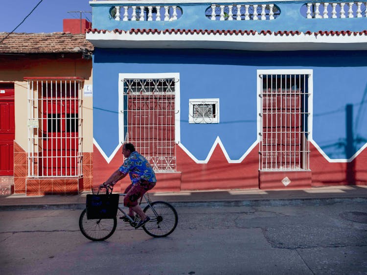 Elderly Man Riding A Bicycle