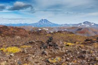 Green and Brown Mountain Under Blue Sky and White Clouds