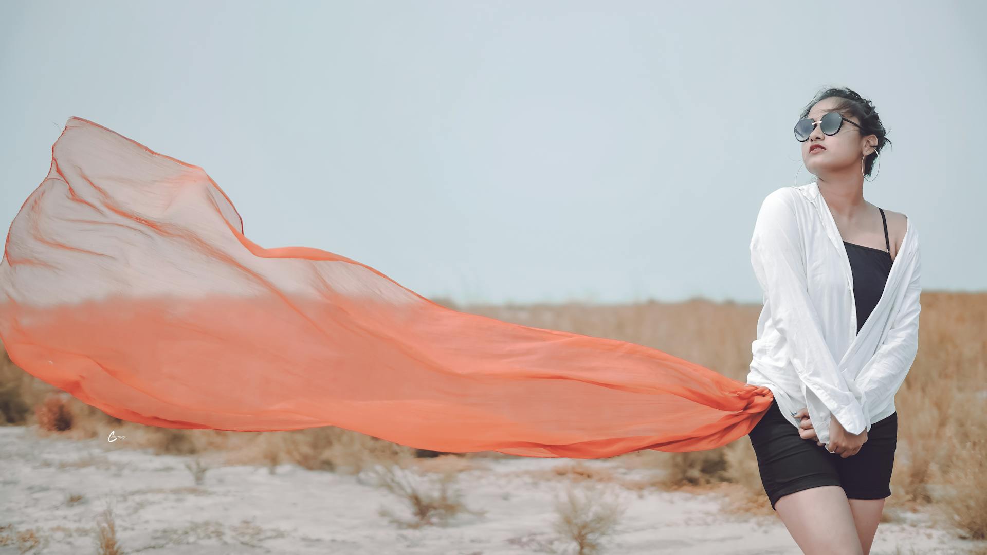 Beautiful Woman in White Dress Shirt and Orange Sheer Textile