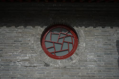 Round Window in a Brick Building