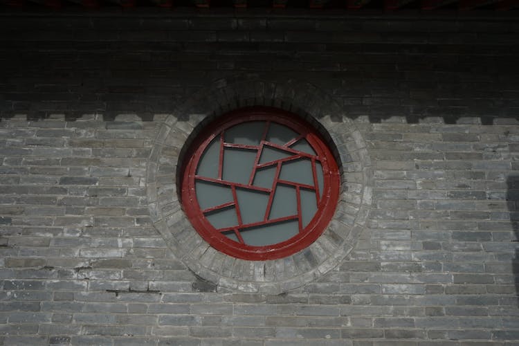 Round Window In A Brick Building