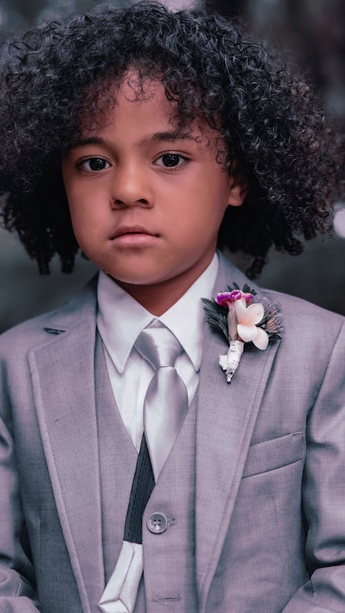 A Boy Wearing a Gray Suit