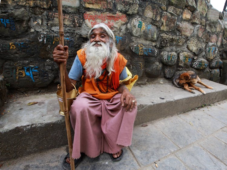 Elderly Monk With A Stick 