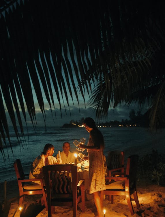 People Dining at the Beach