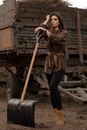 Woman in Brown long Sleeves Holding a Shovel