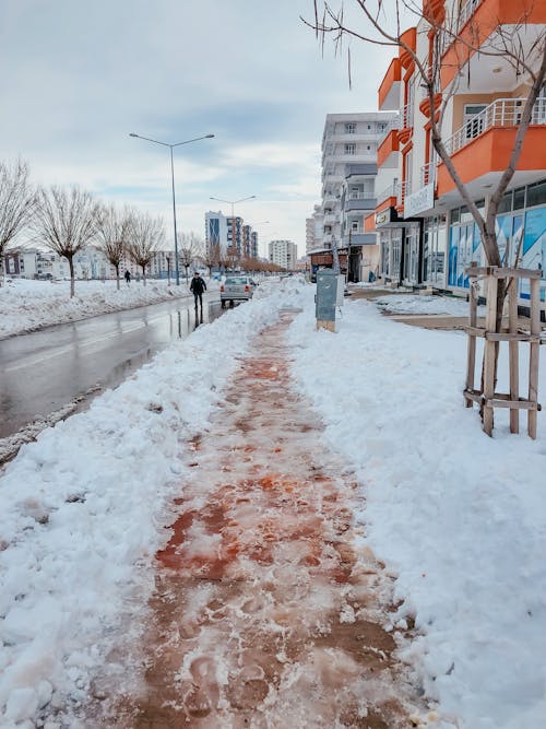 Snow on Sidewalk in Town