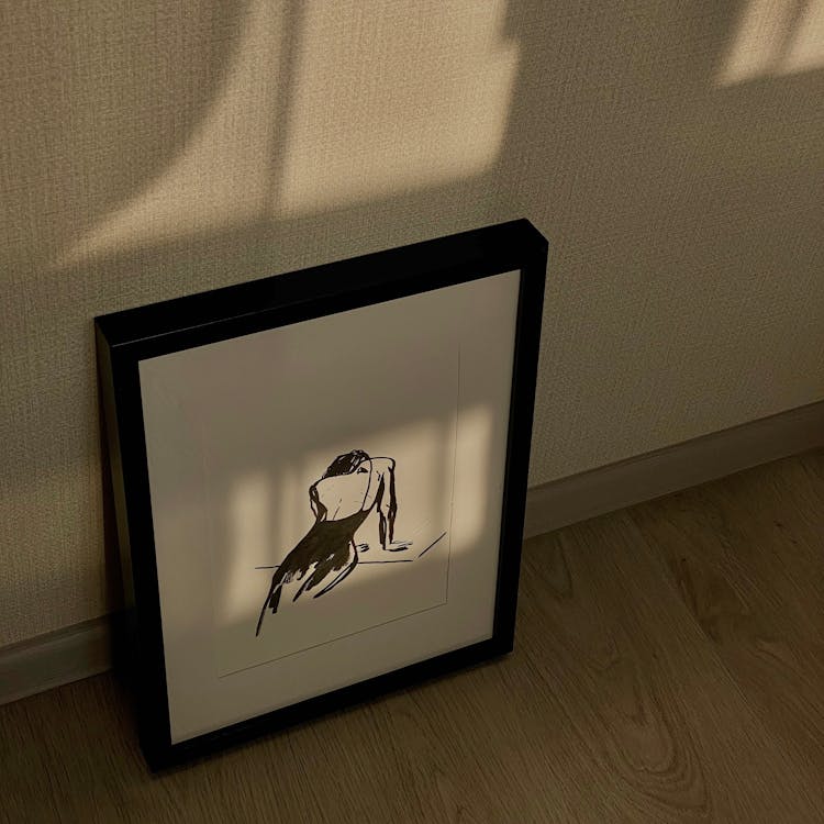 Frame With Drawing On Floor