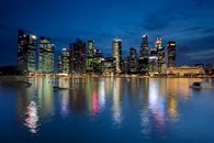 City Skyline Across Body of Water during Night Time