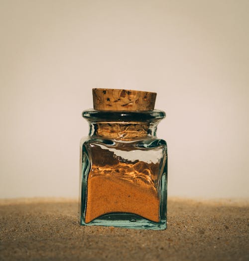 Close-up of a Glass Bottle Filled with Sand