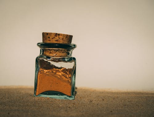 Close-up of a Glass Bottle Filled with Sand