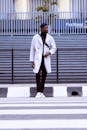 man on a jacket using the zebra cross
