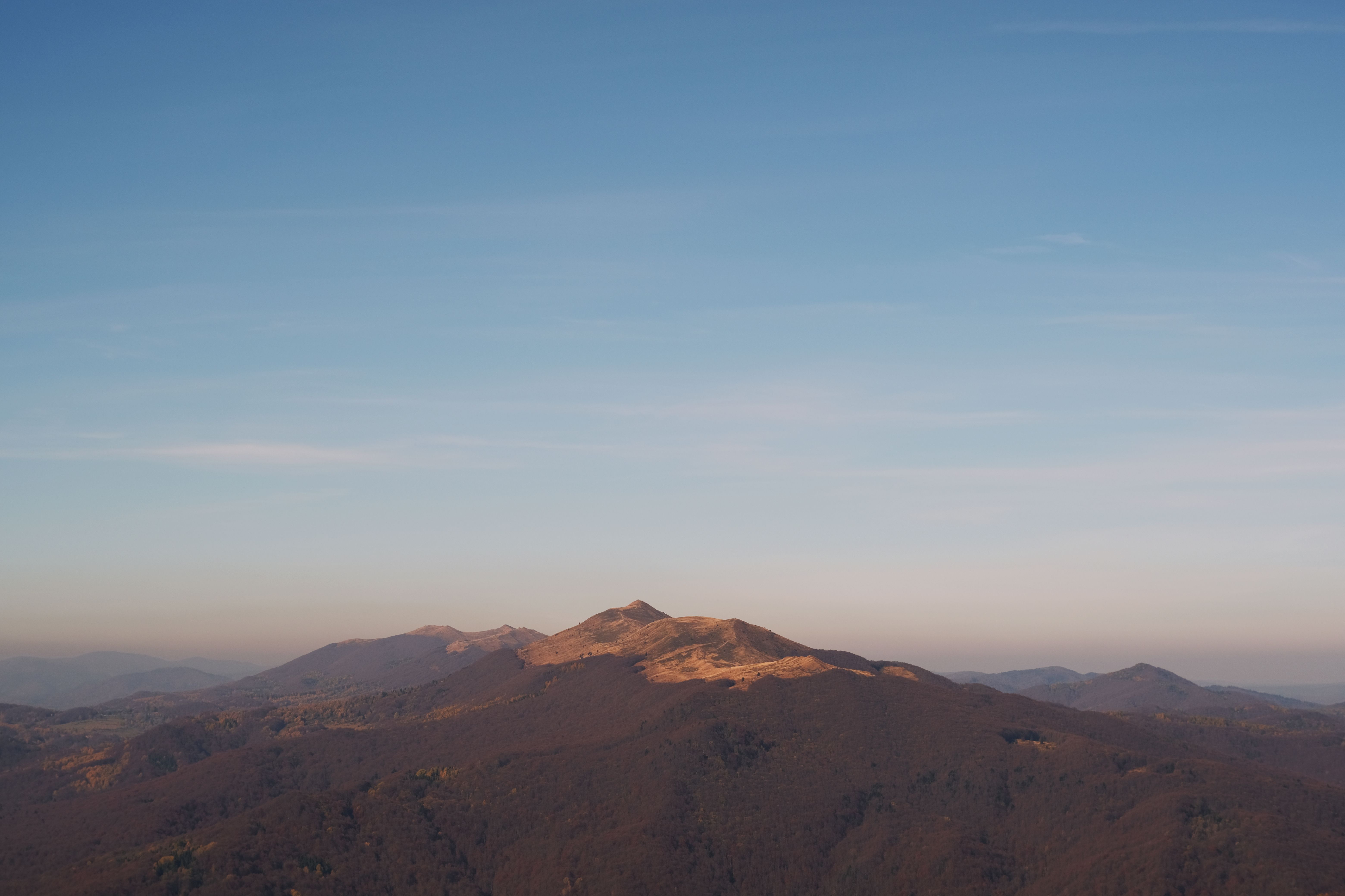 Stunning view of Bieszczady Mountains under a clear blue sky, perfect for nature lovers.