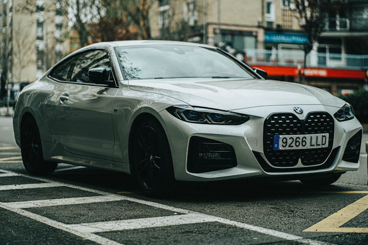 A Parked White Coupe 