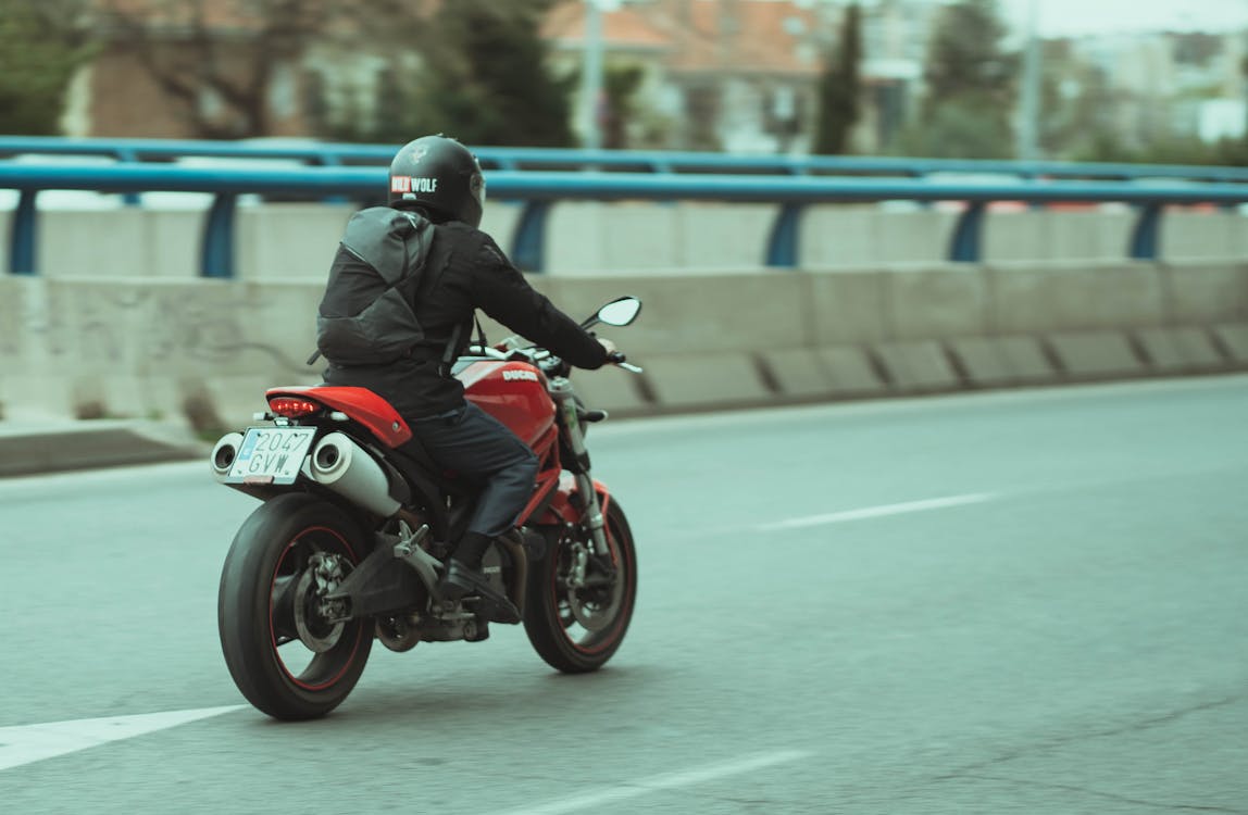 Free A Person Riding a Motorcycle Stock Photo