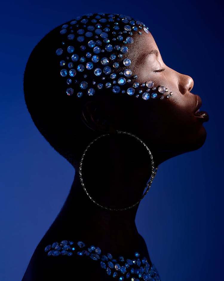 Portrait Of Woman Covered In Blue Crystals