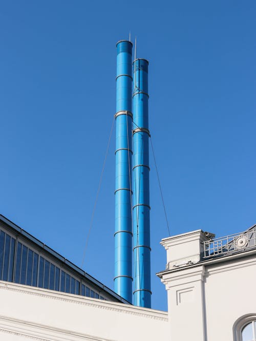 Steel Smoke Stack under Clear Blue Sky 