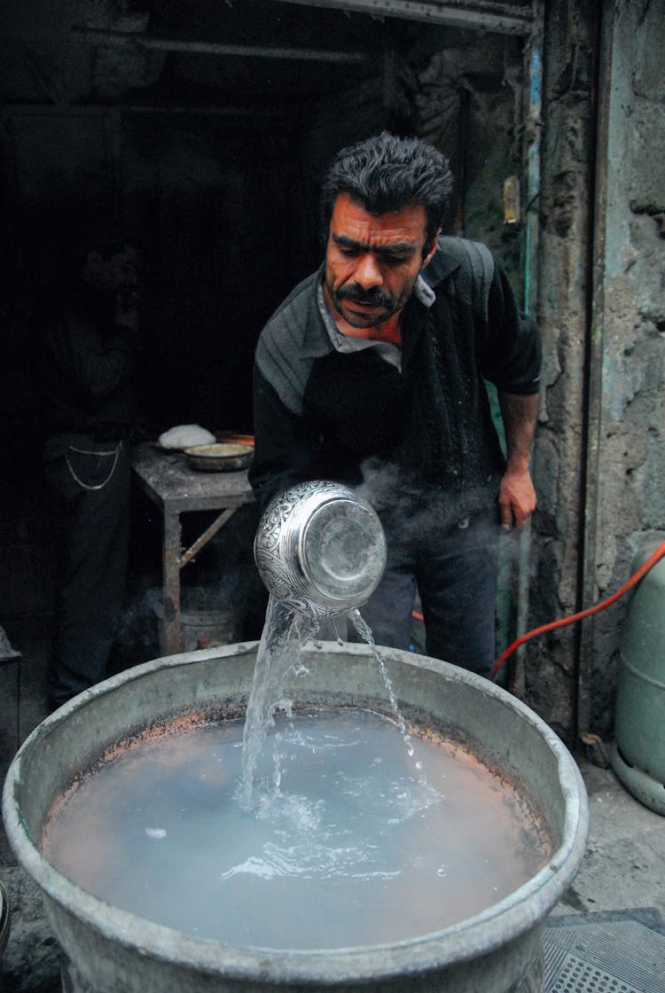 Man Manufacturing Metal Bowls