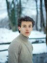 Boy in Gray Crew Neck Shirt Standing on Snow Covered Ground