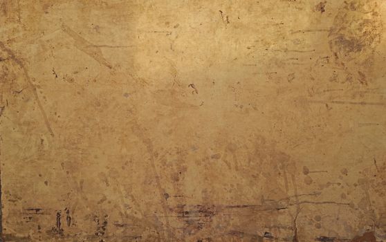 Close-up of a grungy yellow wall with texture and stains, perfect for backgrounds.