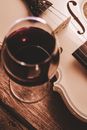 Glass of Wine Beside a Violin