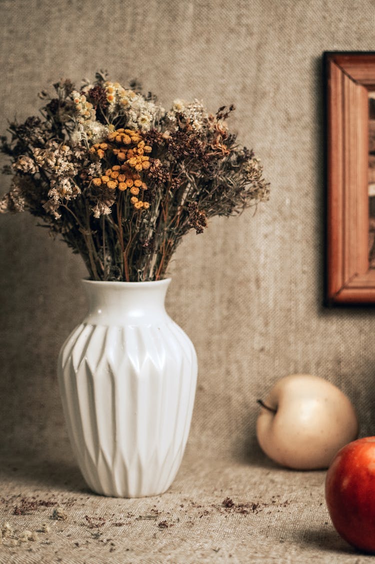 Dry Flowers In A White Vase