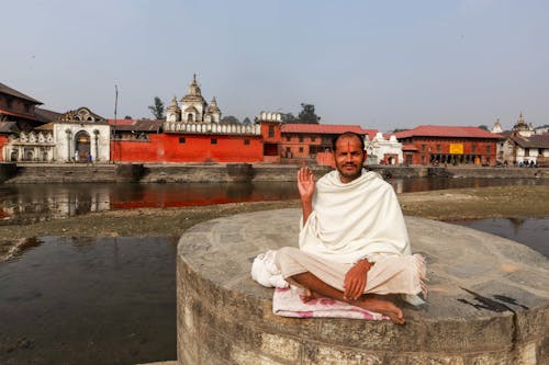 Monk Sitting by River