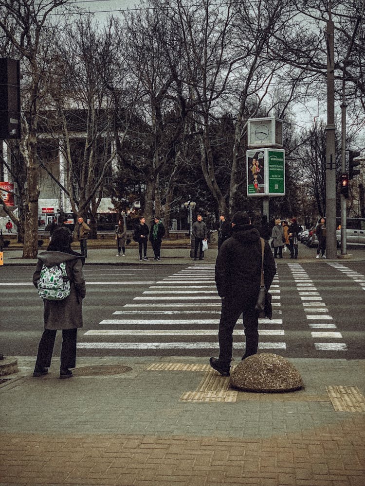 Pedestrians Waiting At Crosswalk