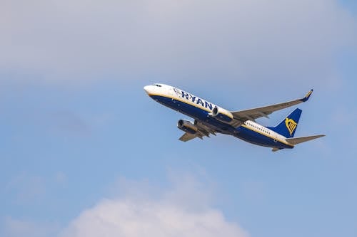 White and Blue Airplane in the Sky