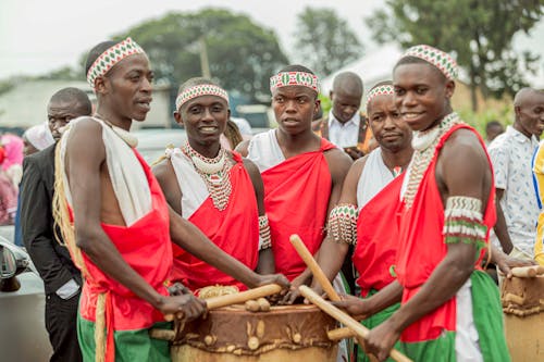 Men Standing with a Drum 