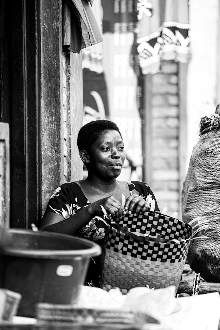 Grayscale Photo Of Woman Basket Weaving