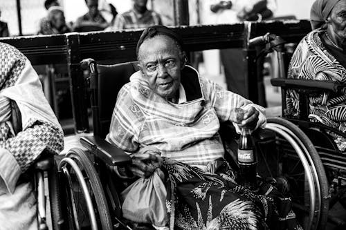 Elderly Woman with Soda Bottle 