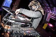 Person in Black Long Sleeve Shirt Playing Dj Controller