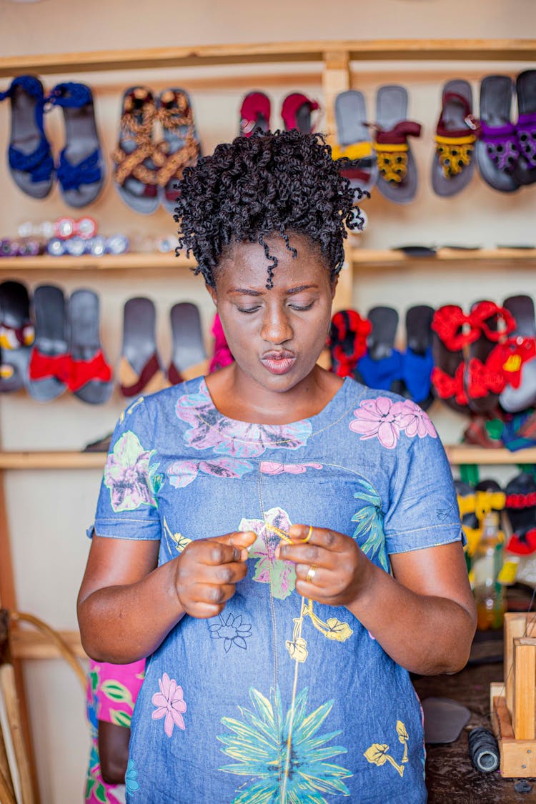 Woman Crocheting In Shoes Store