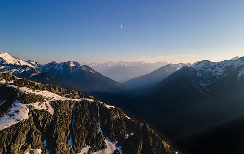 Free Mountain Ranges Under Blue sky Stock Photo