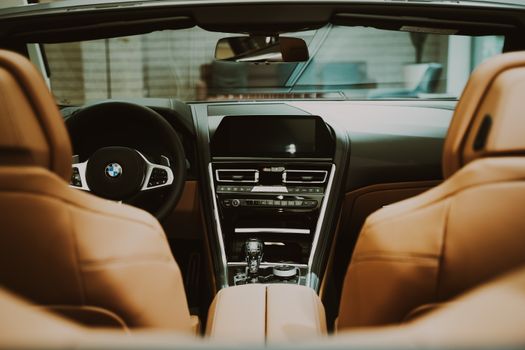 Explore the modern and sleek leather interior of a BMW convertible, highlighting premium design and luxury.