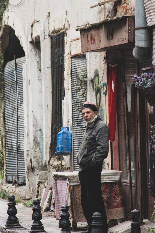 Free A man stands in an urban street of Istanbul, Turkey, showcasing local architecture. Stock Photo
