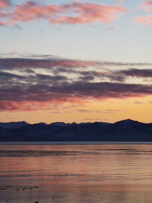 Free Dusk by a Scenic Beach Stock Photo