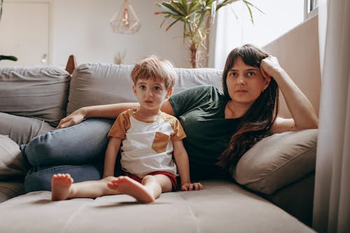 Mother and Son relaxing on a Couch 