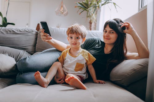 Free 2 Boys and Girl Sitting on Couch Stock Photo