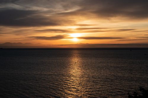 Free Peaceful sunset view over the Pacific Ocean from West Vancouver, capturing a tranquil seascape. Stock Photo