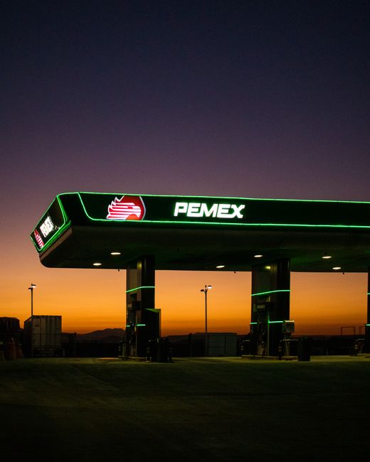 Twilight view of a Pemex gas station in Tizayuca, Mexico with vivid sky hues.
