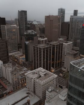 Discover the breathtaking aerial view of Vancouver's urban skyline with towering skyscrapers at dusk.