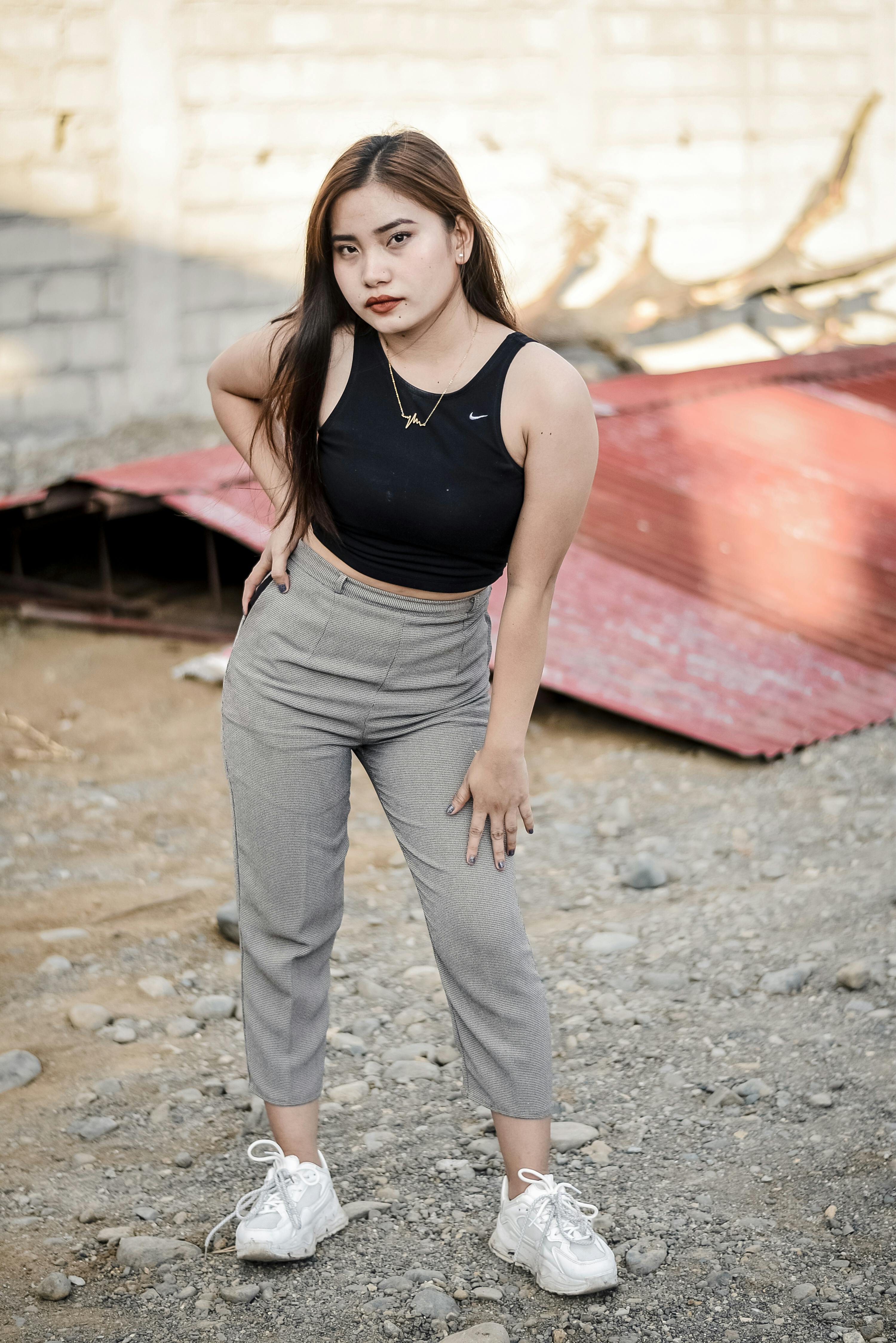 A Woman Wearing Crop Top and Gray Pants · Free Stock Photo