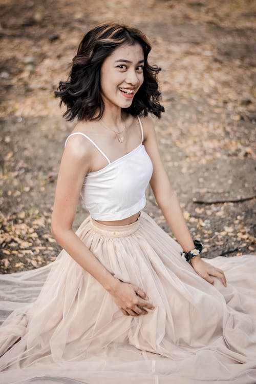 A Woman in White Spaghetti Strap Top