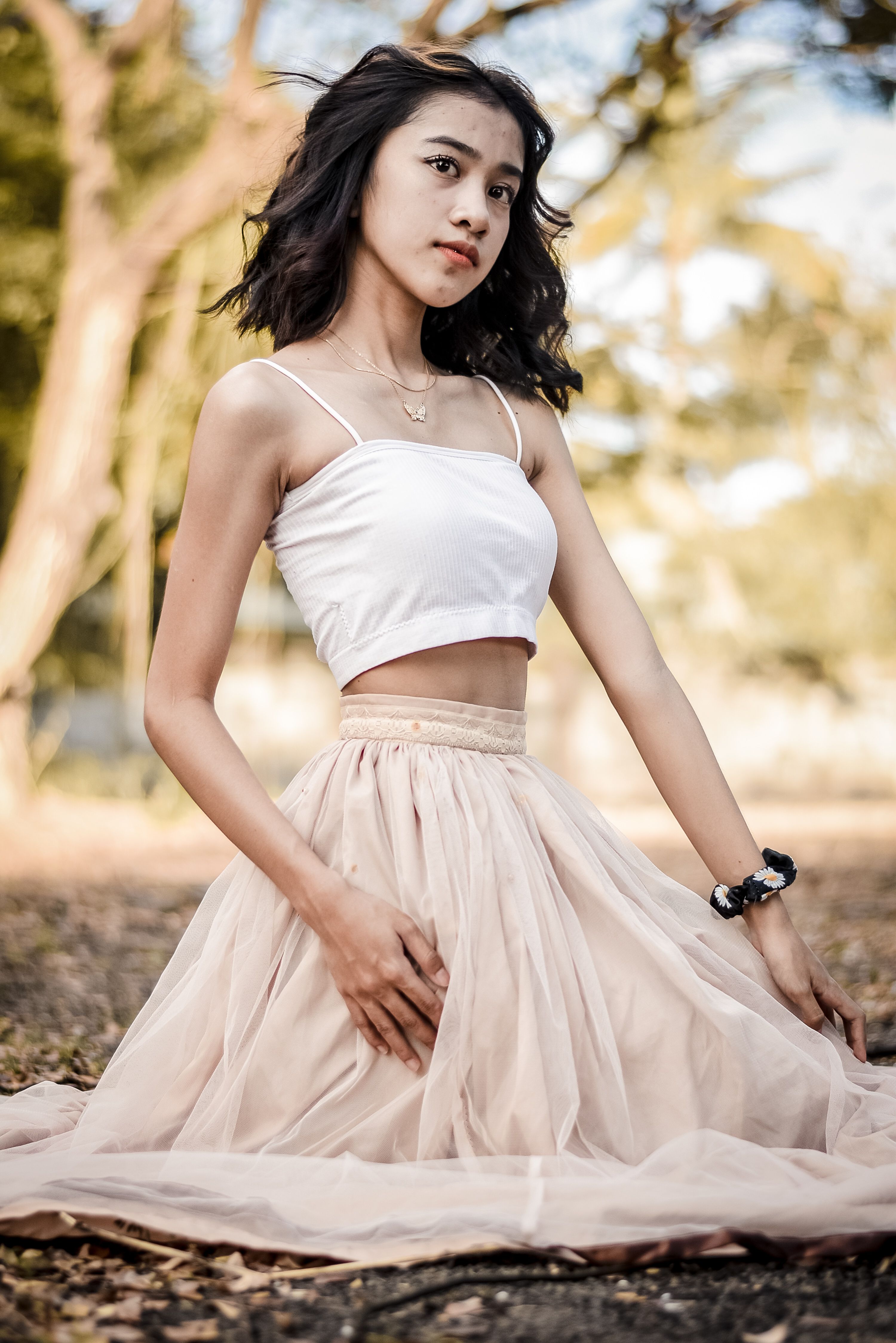 A Woman in a Dress Sitting on the Ground · Free Stock Photo