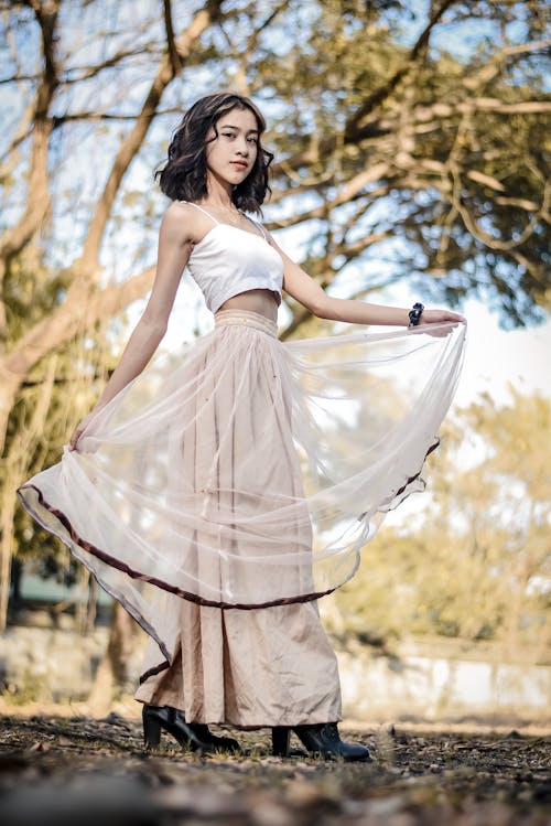 A Woman in White Spaghetti Strap Top