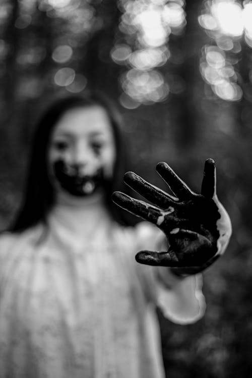 Free Monochrome Photo of Woman with her Hands Painted Black  Stock Photo