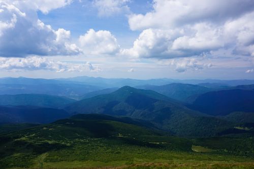 Free Beautiful aerial view of lush mountains under cloudy sky in Zakarpattia Oblast, Ukraine. Stock Photo