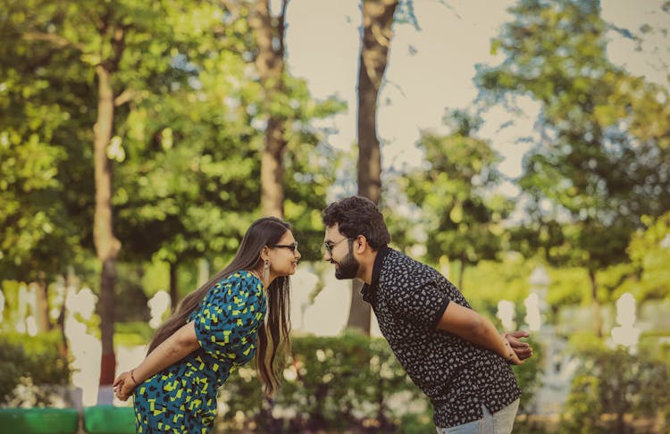 Woman And Man Bowing Before Each Other